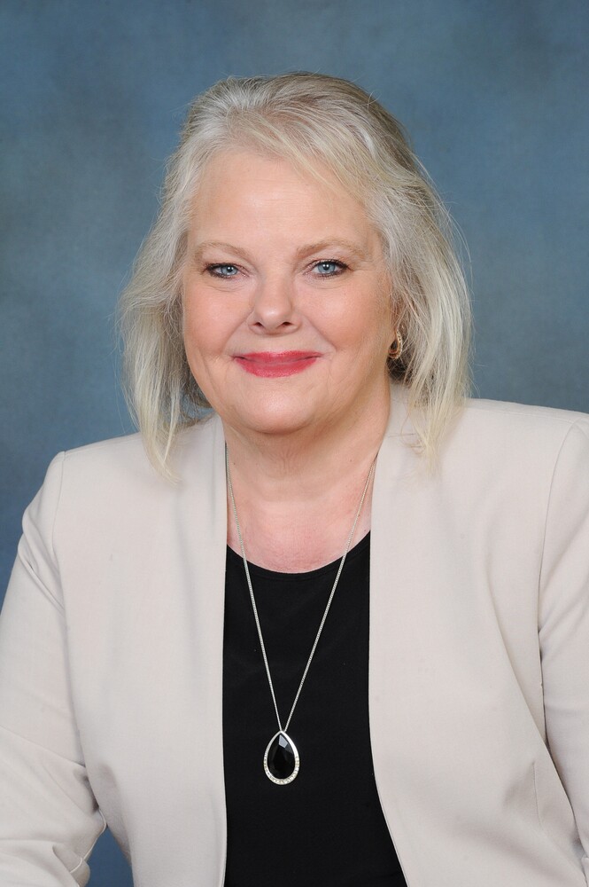 Executive Director Teresa Pope smiling