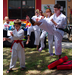 Karate demonstration with 4 people and onlookers.